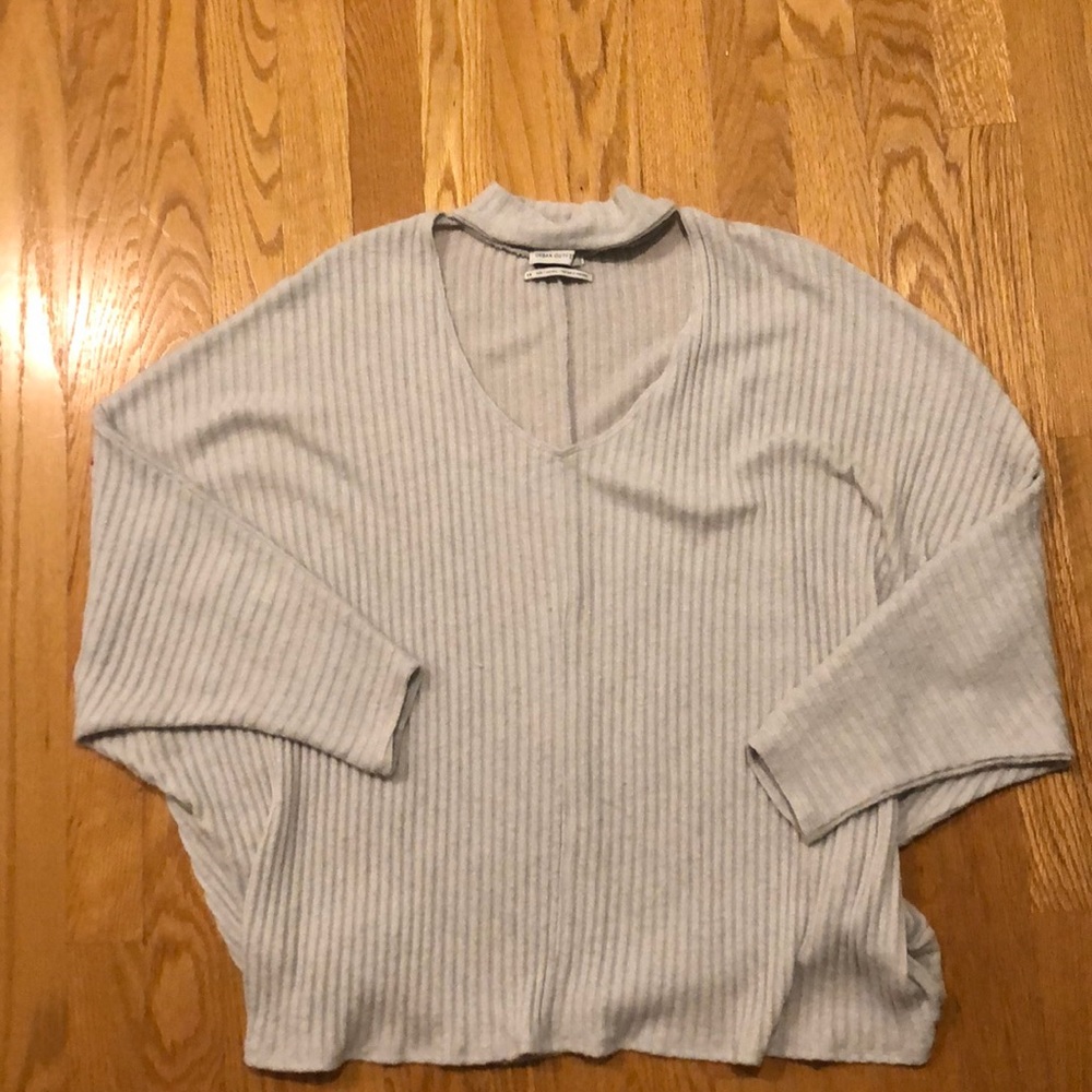 Grey knit sweater with a key hole choker neck